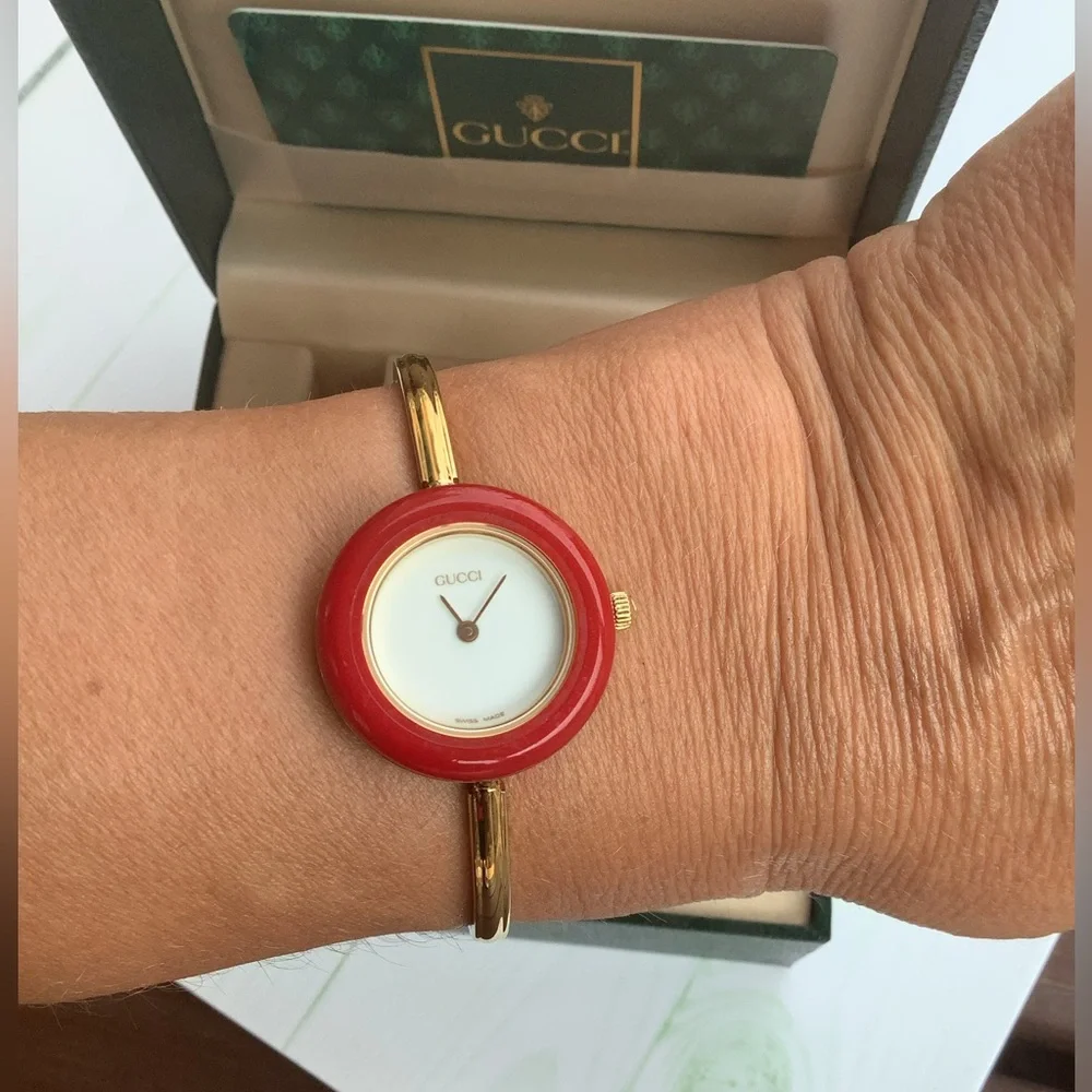 Gucci Women’s Gold Bangle Watch with Interchangeable Color Bezels